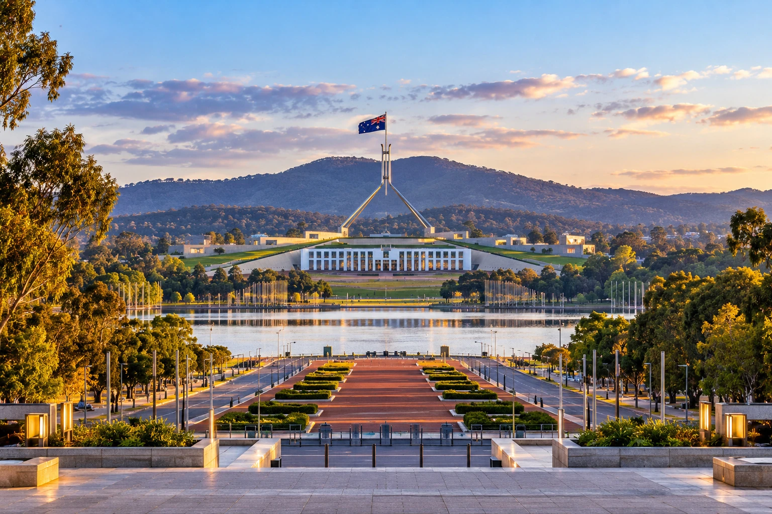 Parliament House across Lake Burley Griffin from Anzac Parade, Canberra, in soft evening light