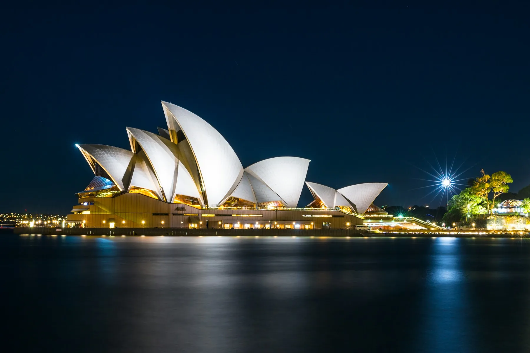 Sydney Opera House and harbour lit at night