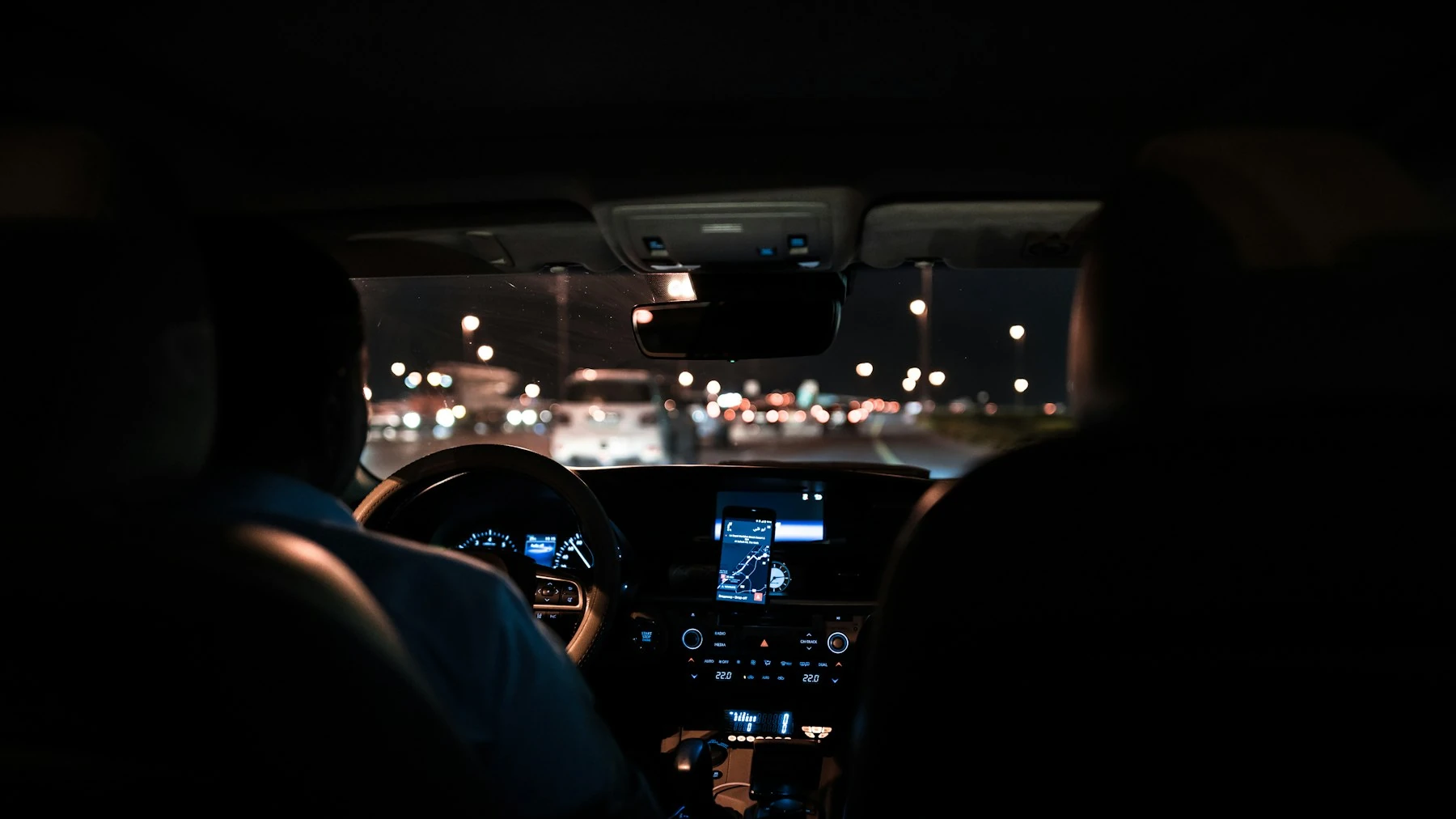 City lights seen from inside a car at night